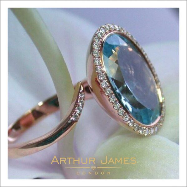 Aquamarine Oval Shape Twisted Halo Ladies Ring